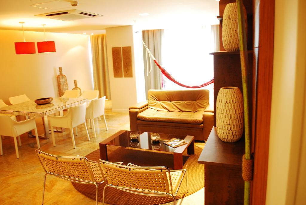 GHL Hotel Montería Zimmer foto A living room in a typical apartment